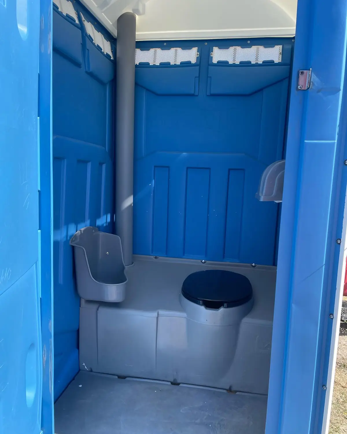 The inside of a blue standard unit after a weekly wash-down and restock