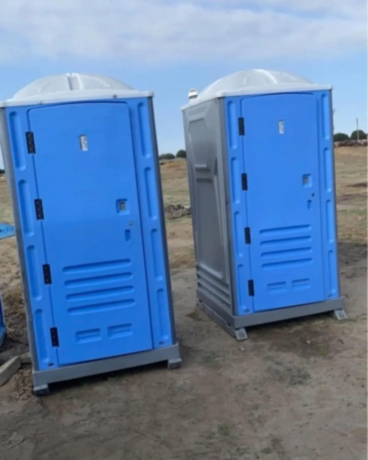 Two standard units staged on a dirt lot for a jobsite delivery
