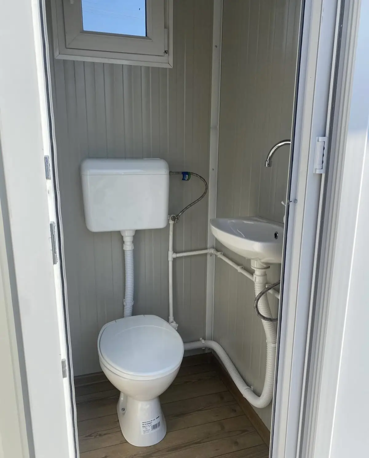 Inside the VIP cabin: flushing toilet, sink and mirror