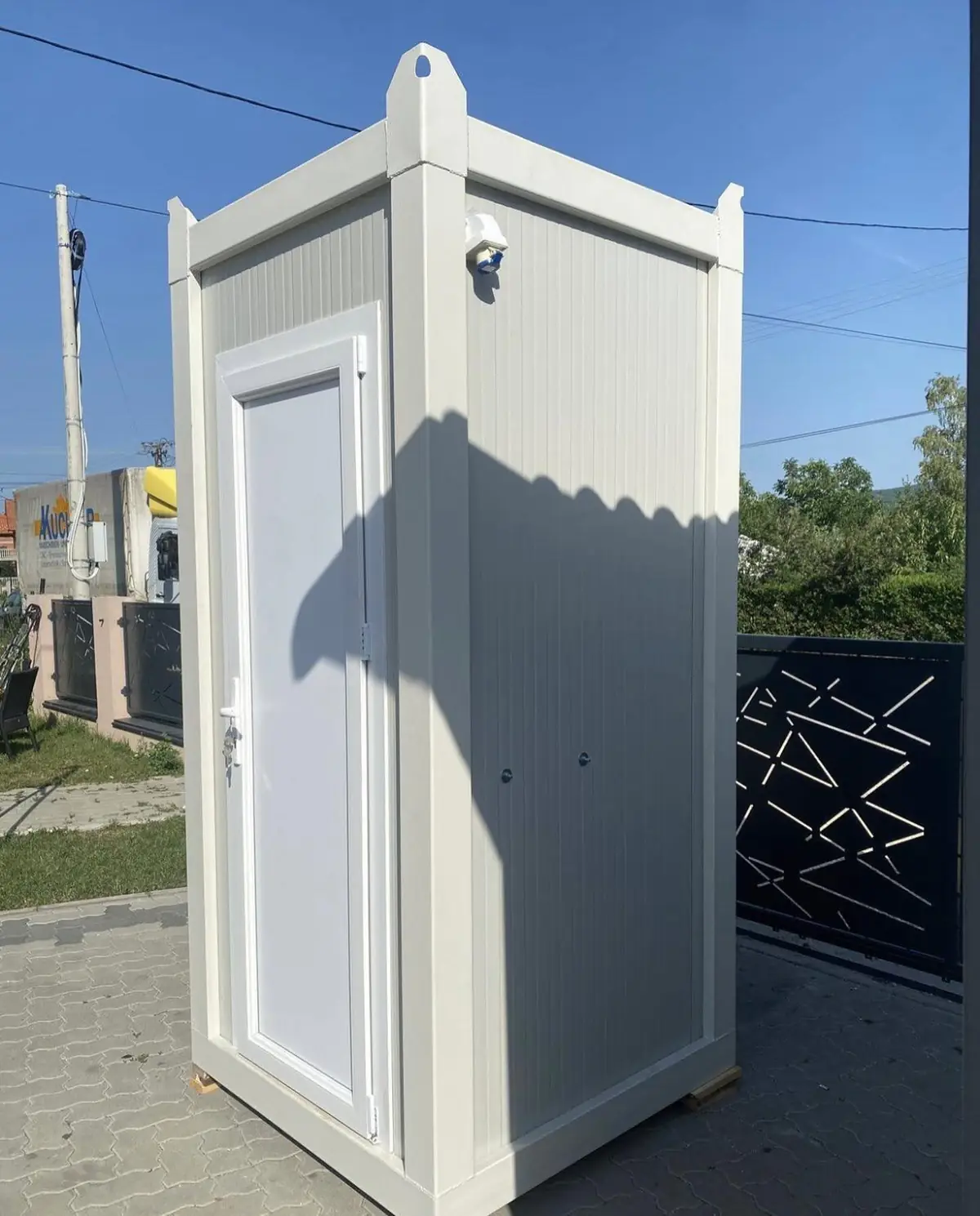 A white VIP restroom cabin, often paired with standard units at events
